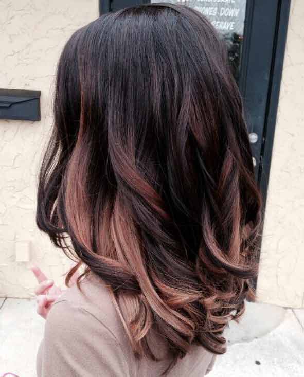 Rose gold highlights on black hair